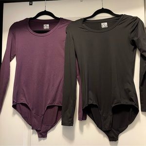 *never worn* 2 long sleeve fitted onesies with double button